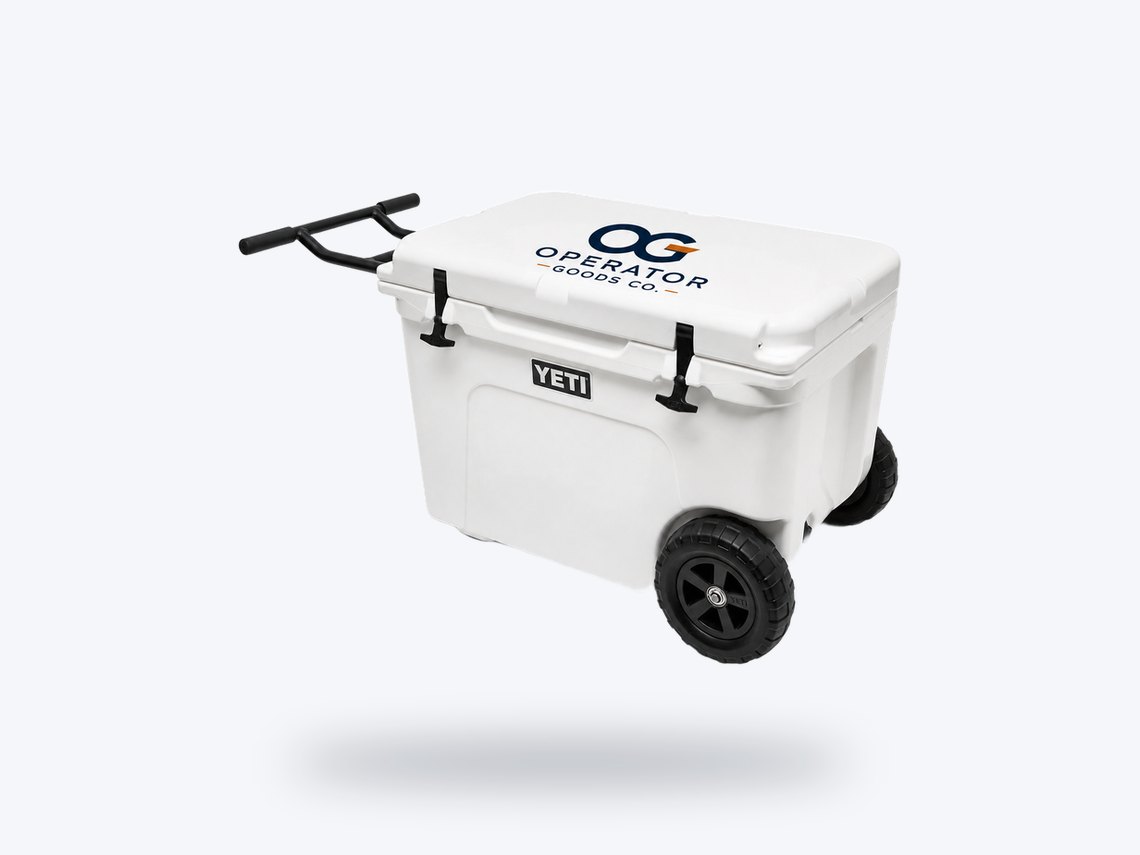 A white YETI hard-sided cooler with the Operator Goods Co. logo on the lid.
